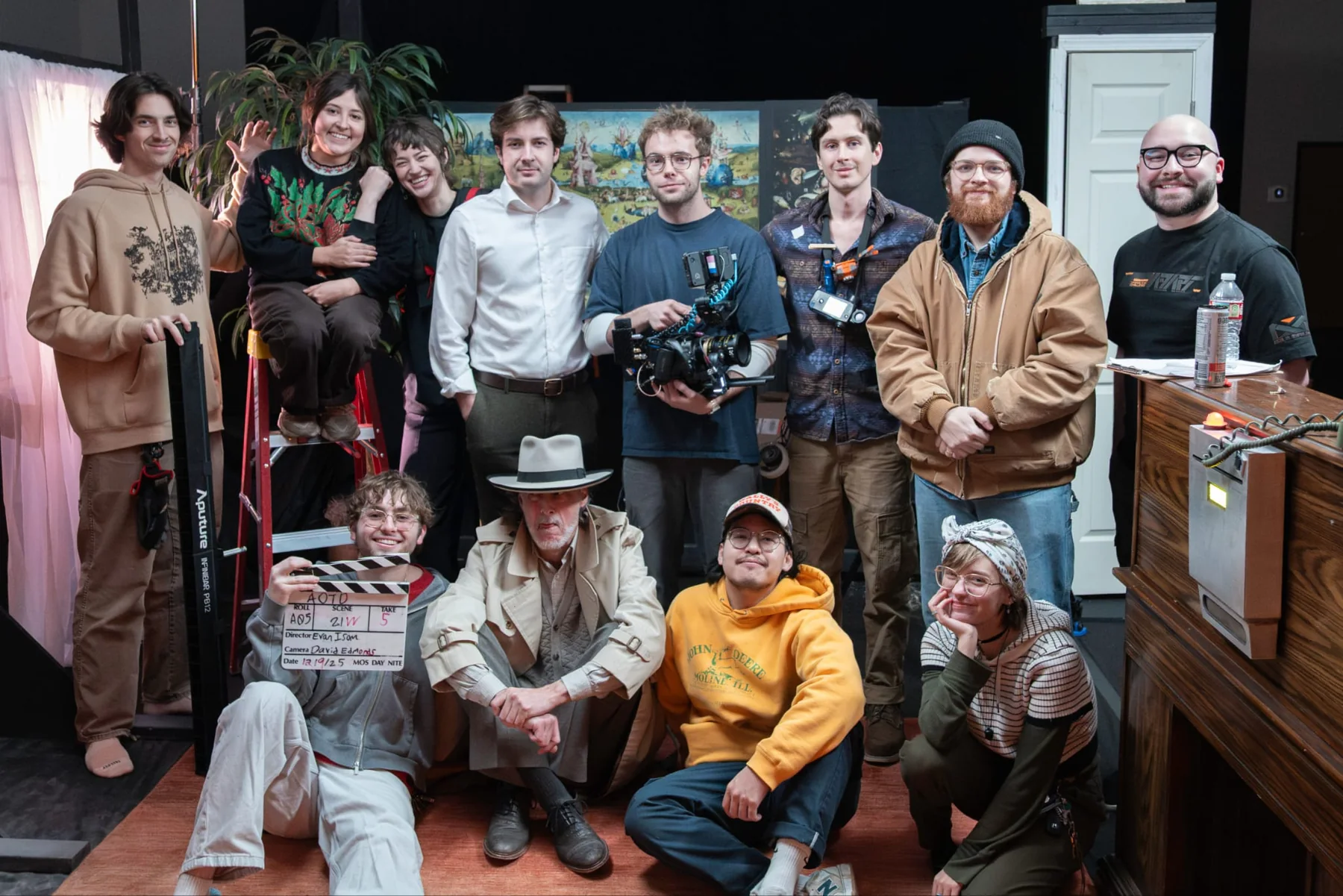 The cast and crew gathered together on the film set.